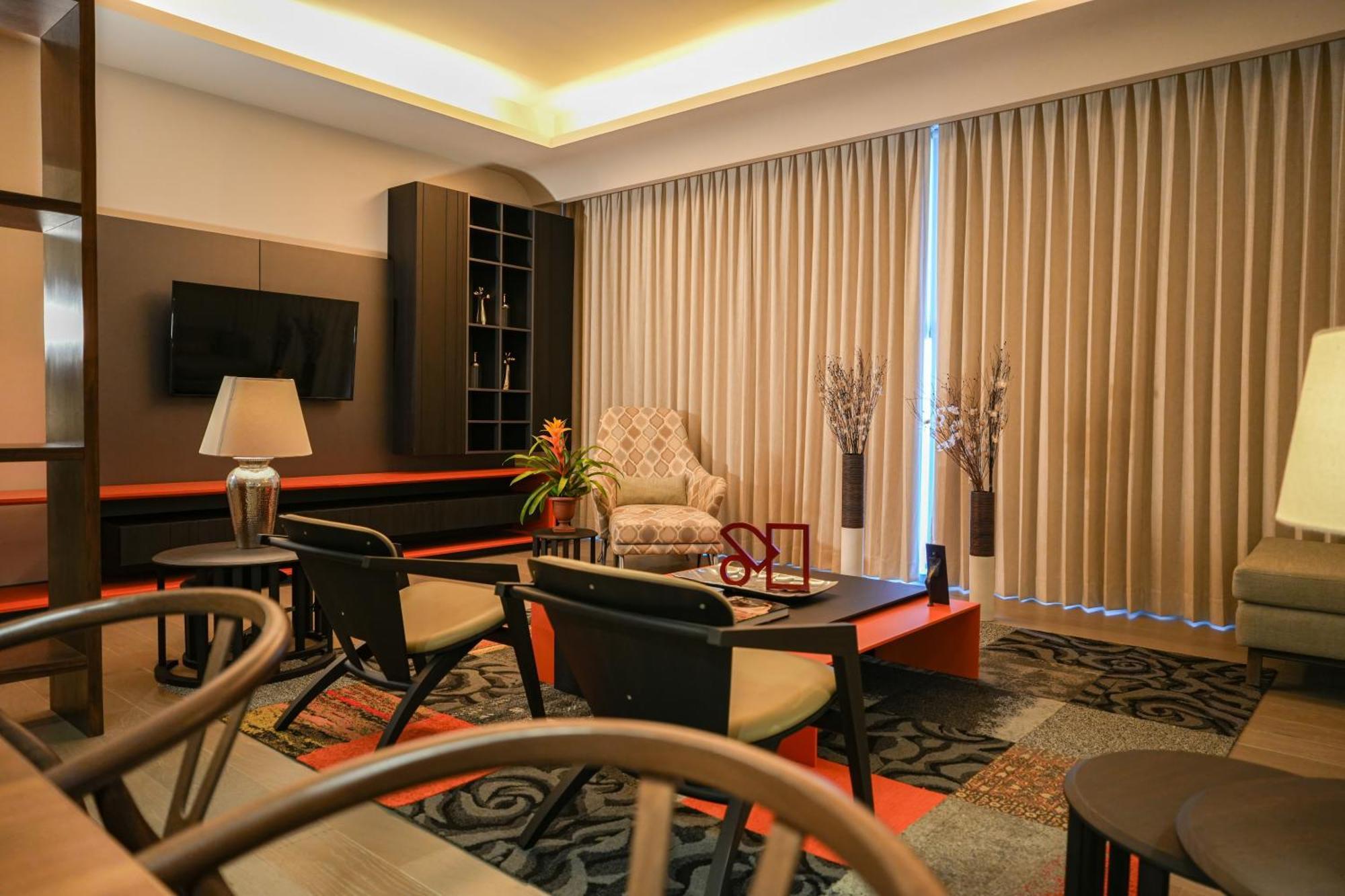 Metria Hotel Leon Ngoại thất bức ảnh A living room in a condominium